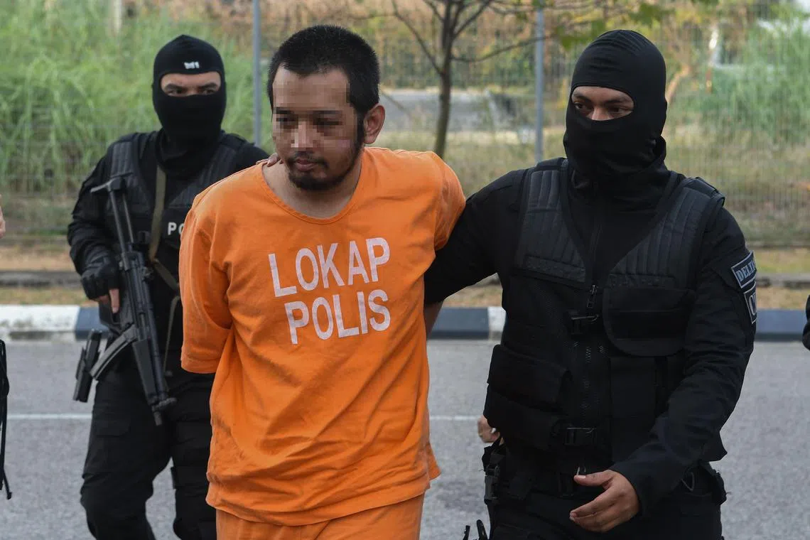 enremand - Suspect Hafizul Harawi was brought to the Kota Bharu magistrate court to have his remand extended.

Credit: Bernama