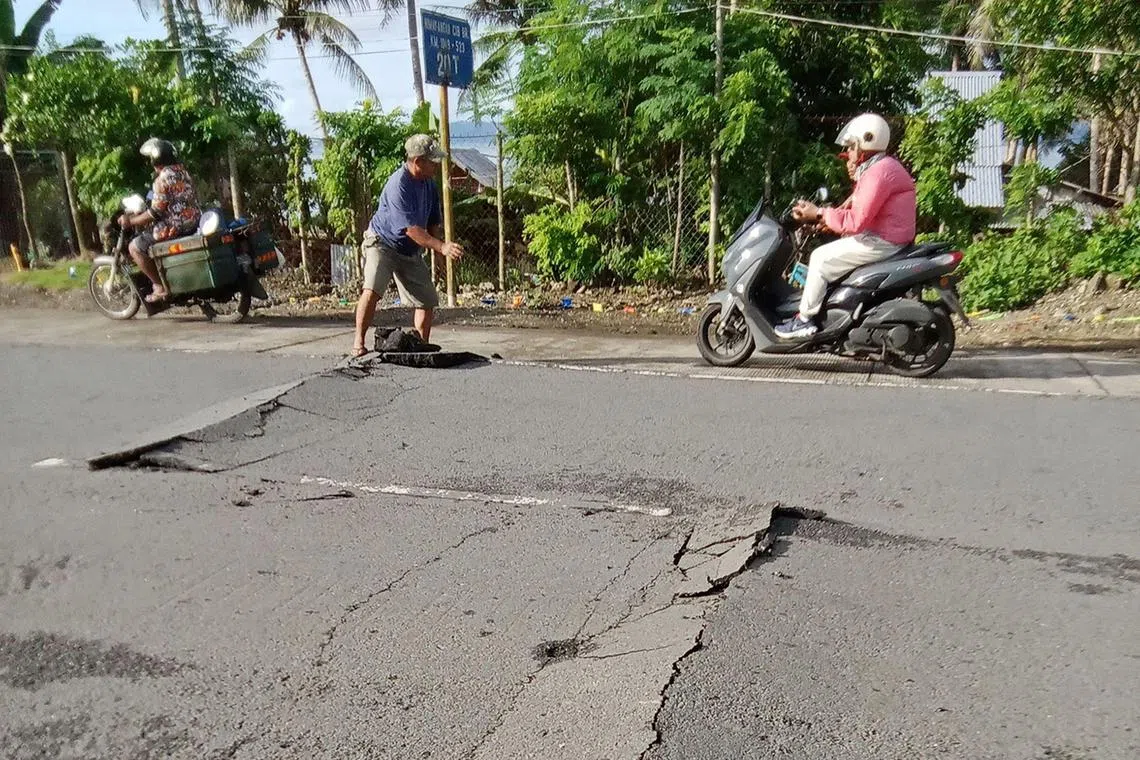 Quakes are a daily occurrence in the Philippines, which sits along the Pacific “Ring of Fire”. This UGC photo taken and posted by Jonathan Guliban on Facebook on Jan 23 shows motorists speeding past a cracked pavement of a highway in Liloan town, Southern Leyte province, after a 5.8 quake hit the province. 