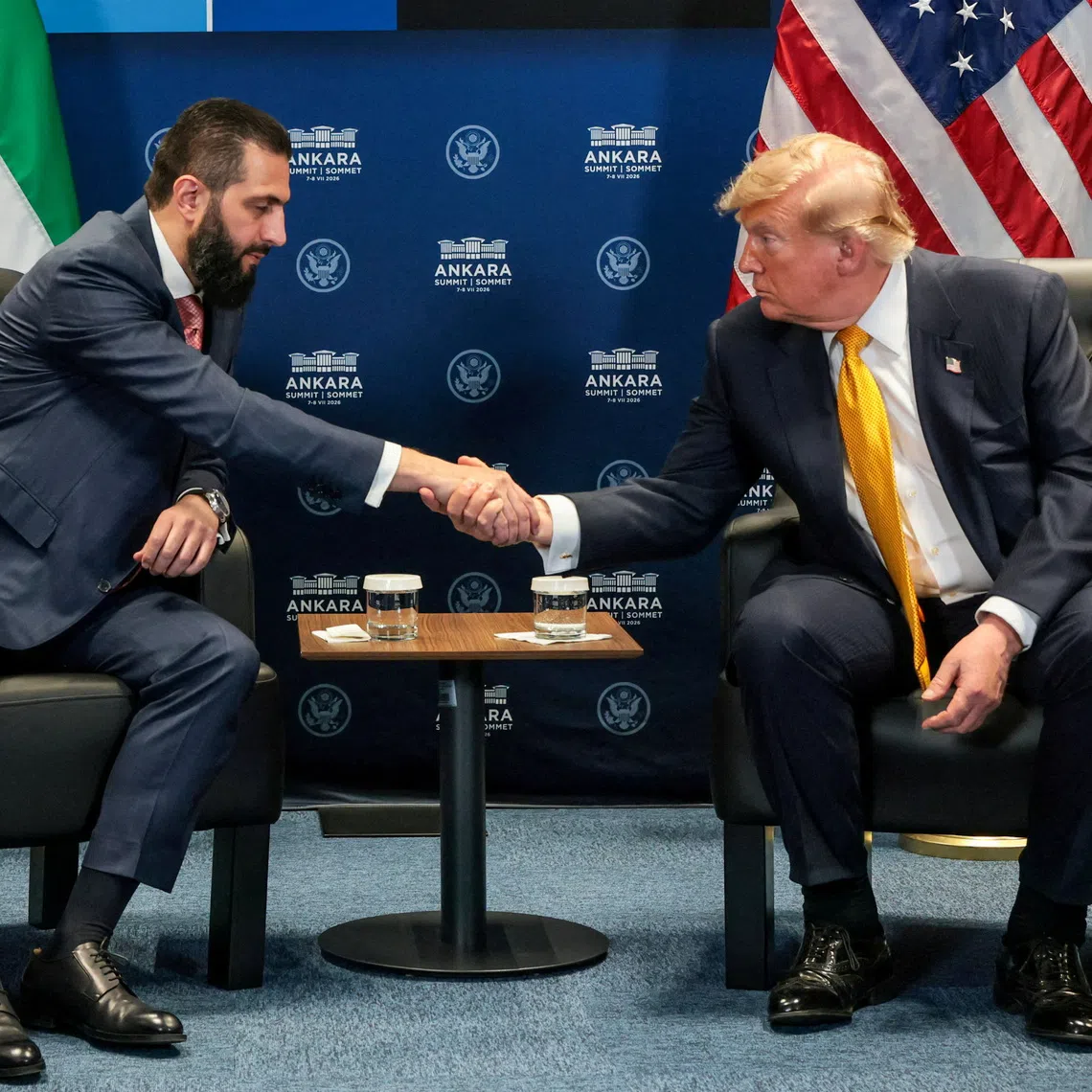 FILE PHOTO: U.S. President Donald Trump shakes hands with Syrian President Ahmed al-Sharaa during a bilateral meeting alongside the NATO leaders summit at the Bestepe Presidential Compound in Ankara, Turkey, July 8, 2026. REUTERS/Jonathan Ernst/File Photo