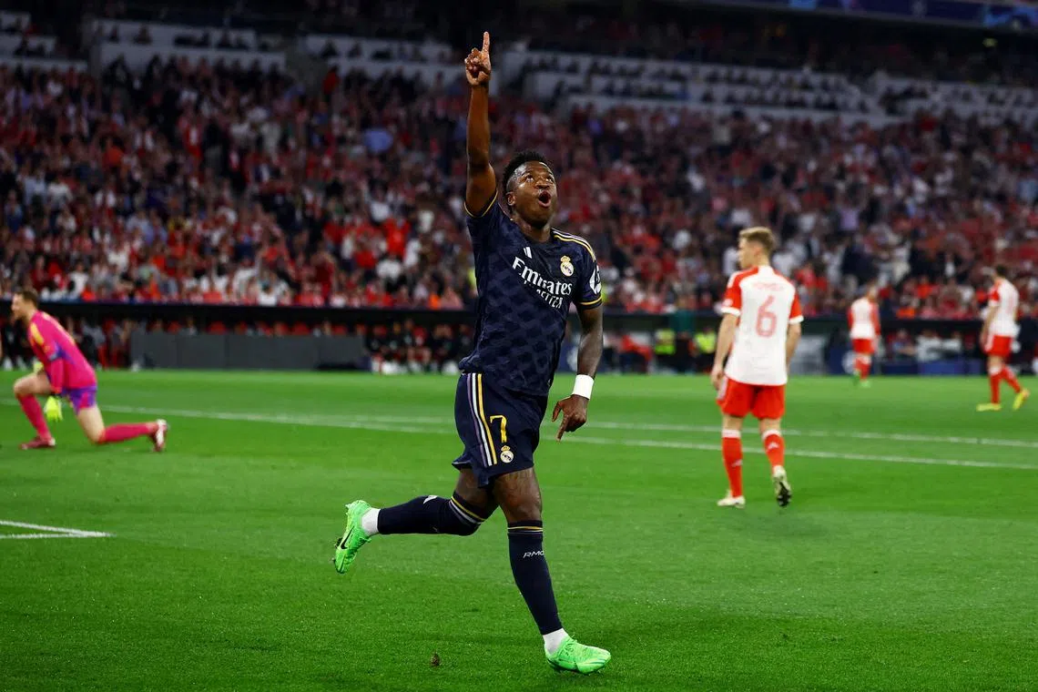 Soccer Football - Champions League - Semi Final - First Leg - Bayern Munich v Real Madrid - Allianz Arena, Munich, Germany - April 30, 2024 Real Madrid's Vinicius Junior celebrates scoring their first goal REUTERS/Kai Pfaffenbach