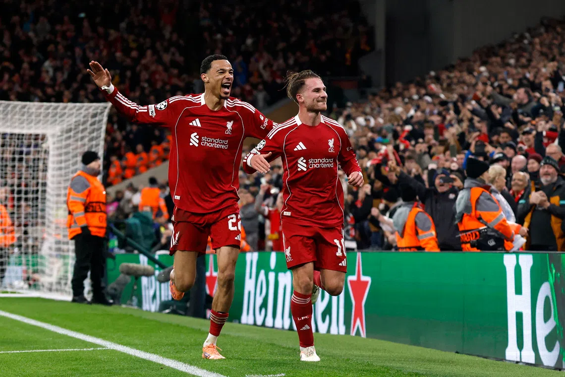 Soccer Football - UEFA Champions League - Liverpool v Real Madrid - Anfield, Liverpool, Britain - November 4, 2025 Liverpool's Alexis Mac Allister celebrates scoring their first goal with Hugo Ekitike Action Images via Reuters/Jason Cairnduff