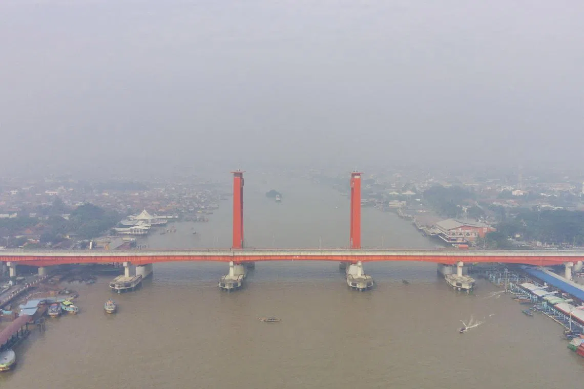 An aerial view of the Ampera Bridge over the Musi river amid haze due to a wildfire in Palembang, South Sumatra last month.