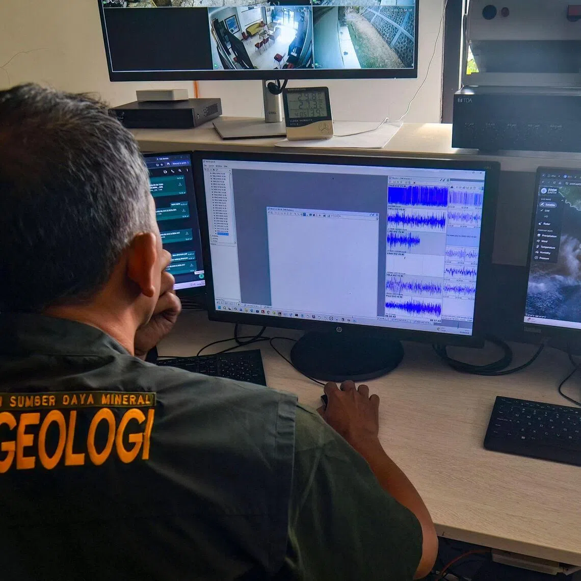 An officer monitors Mount Anak Krakatau’s volcanic activity in Serang, Banten, on Sept 5.