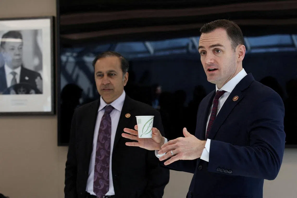 FILE PHOTO: US Congressman Mike Gallagher (R-WI), chairman of the House Select Committee on the Chinese Communist Party speaks as Ranking member Raja Krishnamoorthi (D-IL), looks on during a biotech science fair in Cambridge, Massachusetts, U.S., February 12, 2024. REUTERS/Reba Saldanha/File Photo