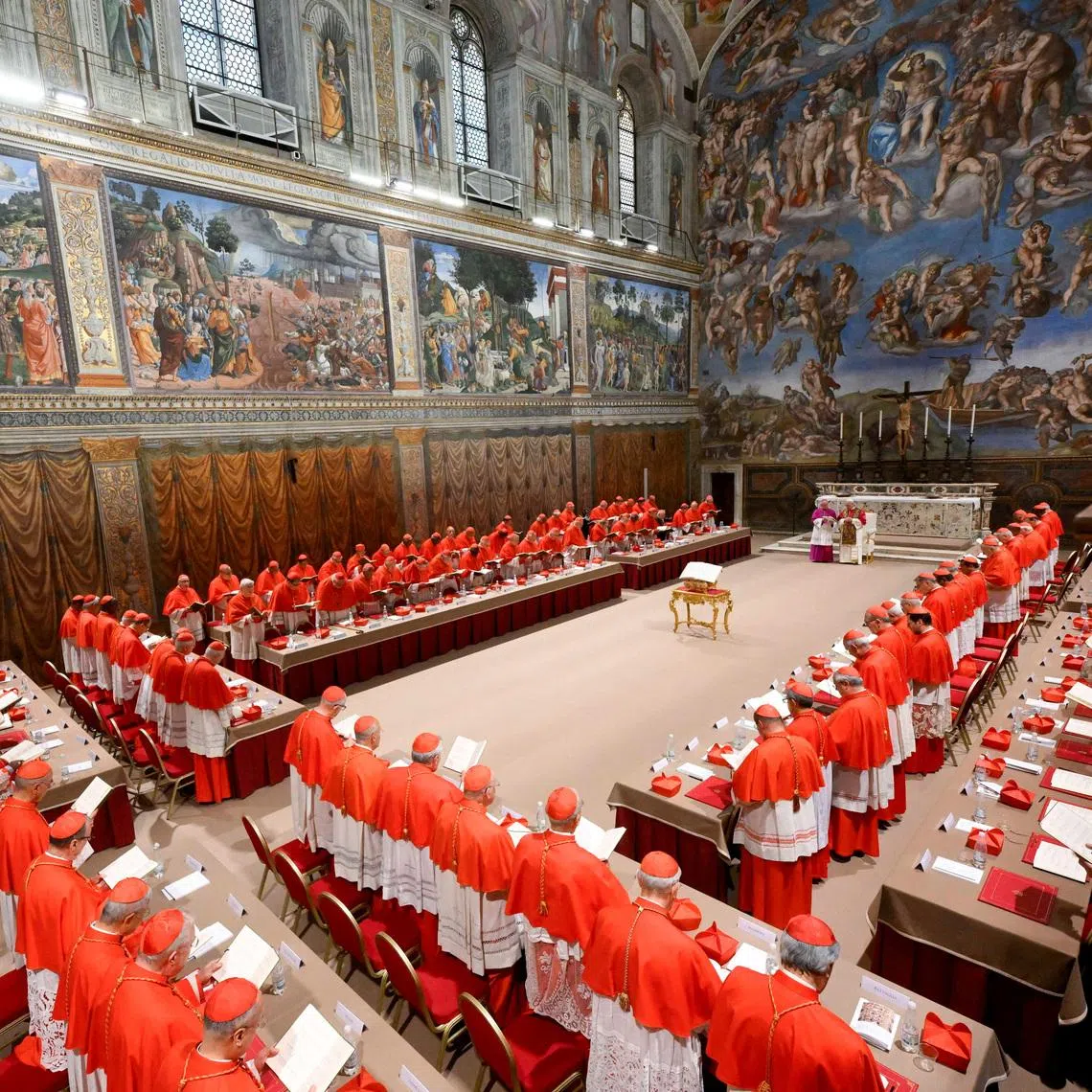 FILE PHOTO: Pope Leo XIV stands in the Sistine Chapel among cardinals after being elected, at the Vatican, May 8, 2025. Vatican Media/­Francesco Sforza/Handout via REUTERS/ File Photo