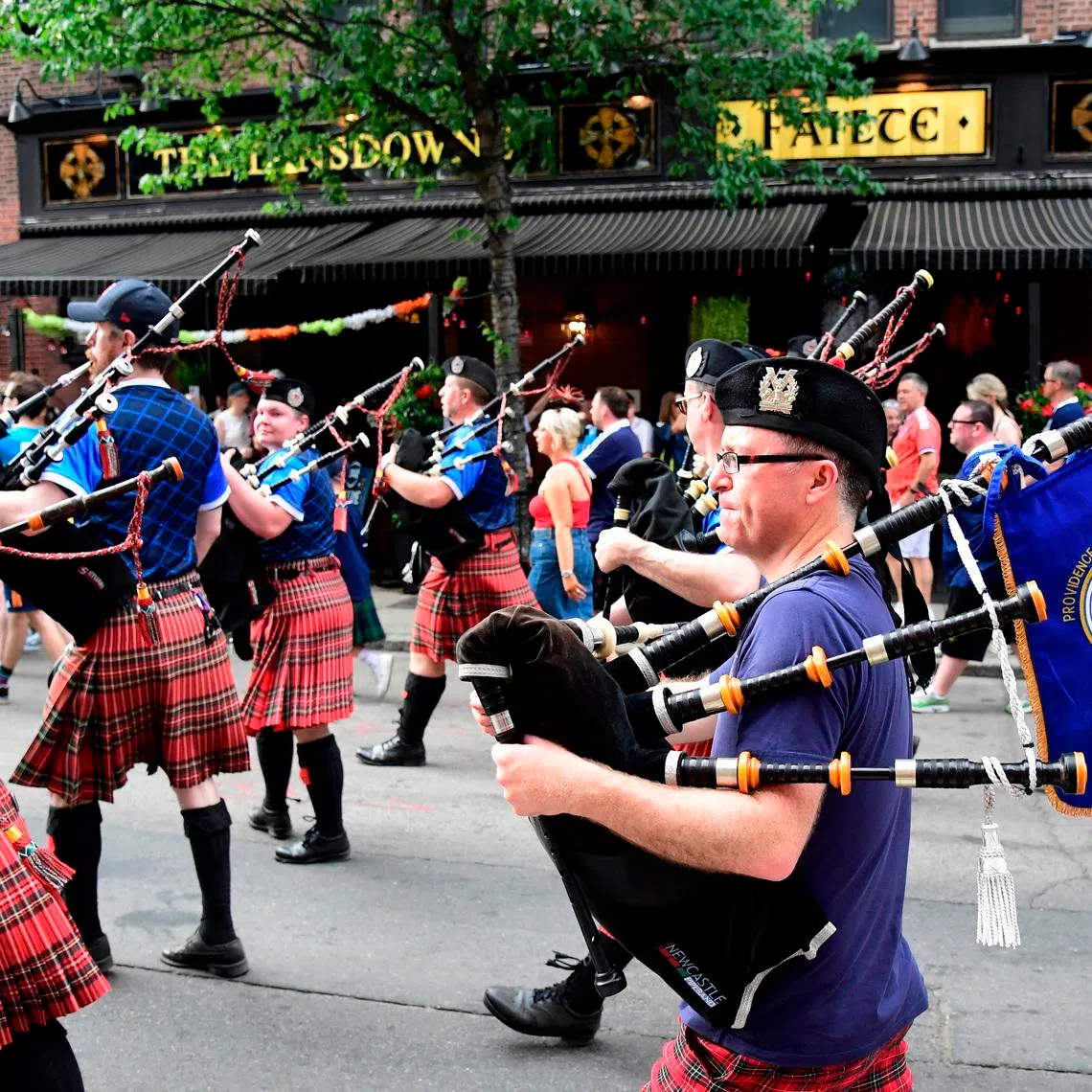 Soccer Football - FIFA World Cup 2026 - Scotland's Tartan Army march to Boston's Fenway Park baseball stadium - Boston, Massachusetts, U.S. - June 14, 2026 Scotland fans wearing kilts and playing the bagpipes during the march to Fenway Park IMAGN IMAGES via Reuters/Bob Dechiara