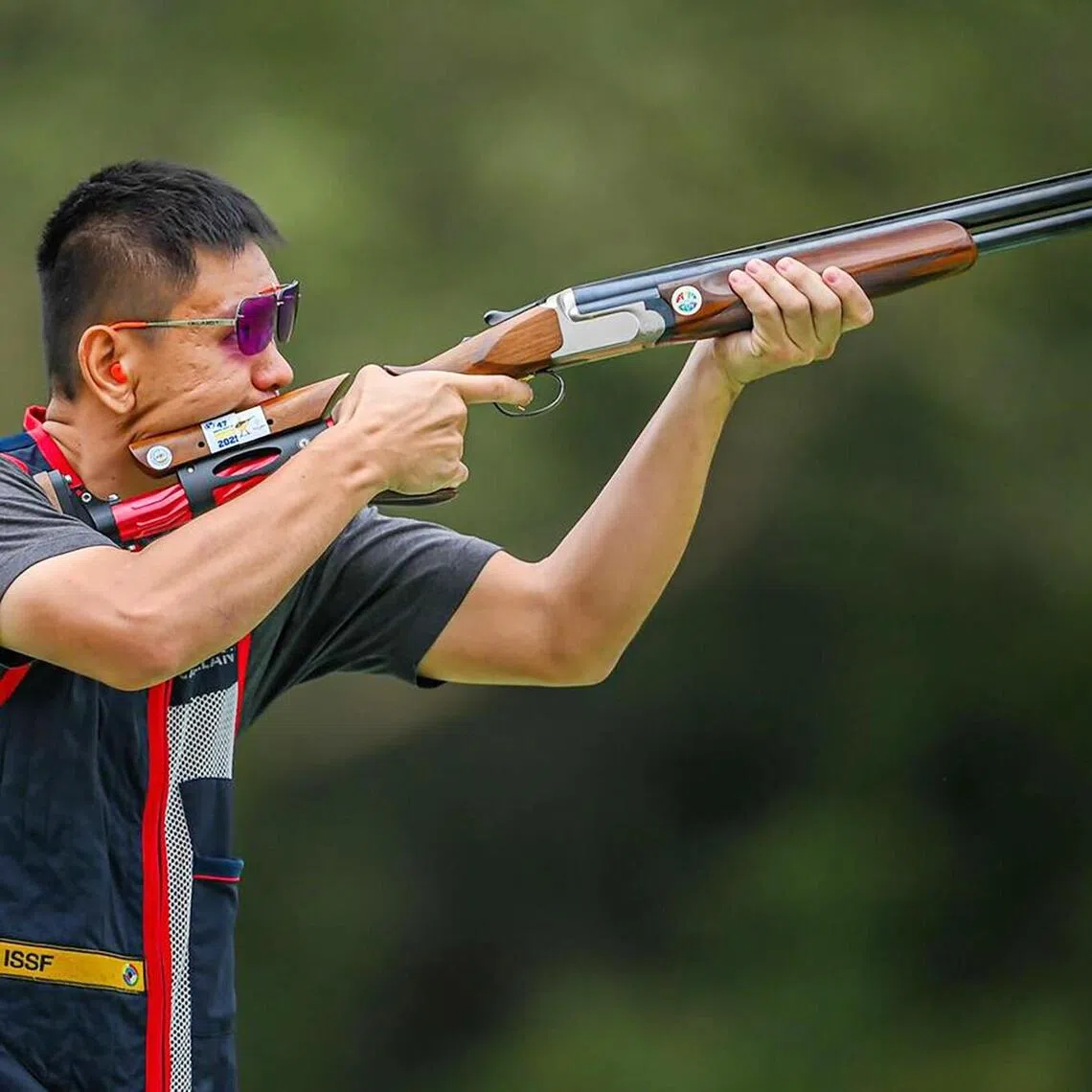 Singapore's Low Jiang Hao firing his way to a gold in skeet shooting at the 2025 SEA Games in Thailand.