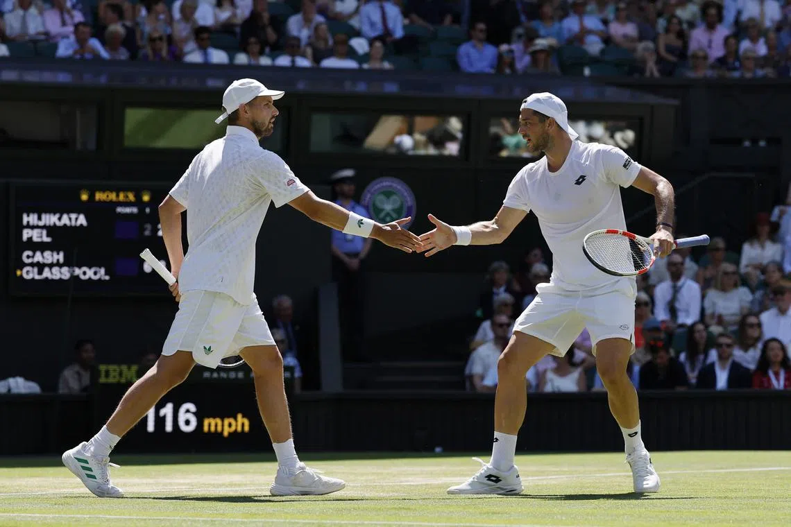 Tennis - Wimbledon - All England Lawn Tennis and Croquet Club, London, Britain - July 12, 2025 Britain's Lloyd Glasspool and Julian Cash reacts during the men's doubles final against Australia's Rinky Hijikata and Netherlands' David Pel REUTERS/Stephanie Lecocq