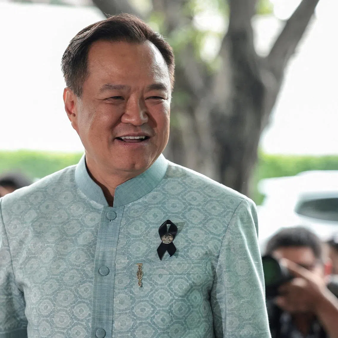 FILE PHOTO: Anutin Charnvirakul, Thailand's caretaker Prime Minister, Bhumjaithai Party leader and prime ministerial candidate, reacts upon arrival ahead of a meeting with party members at Bhumjaithai Party headquarters, after the party won the general election, in Bangkok, Thailand, February 12, 2026. REUTERS/Chalinee Thirasupa/File Photo