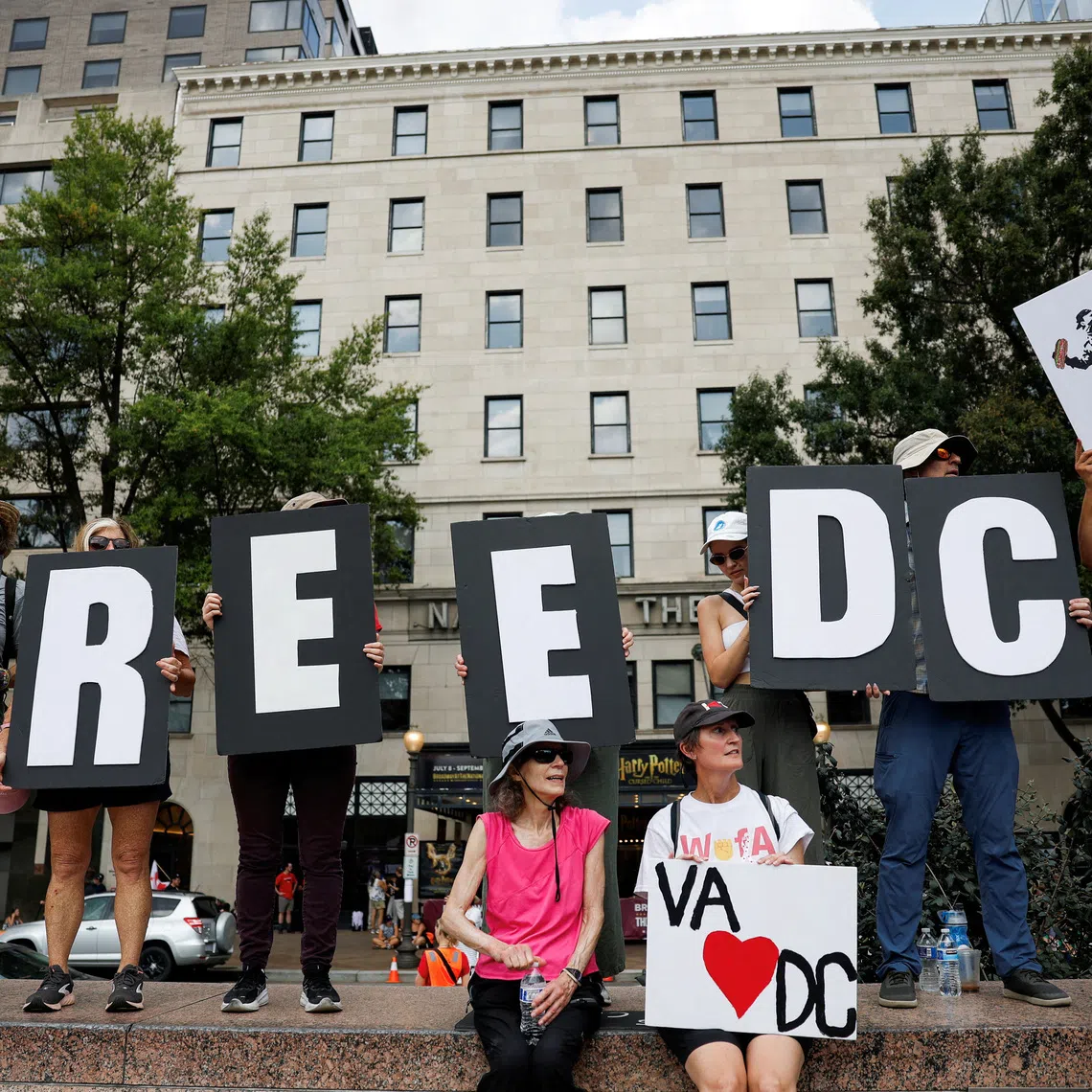 FILE PHOTO: Demonstrators attend the \"We Are All D.C.\" protest against the National Guard troops, in Washington, D.C., U.S., September 6, 2025. REUTERS/Daniel Becerril/File Photo