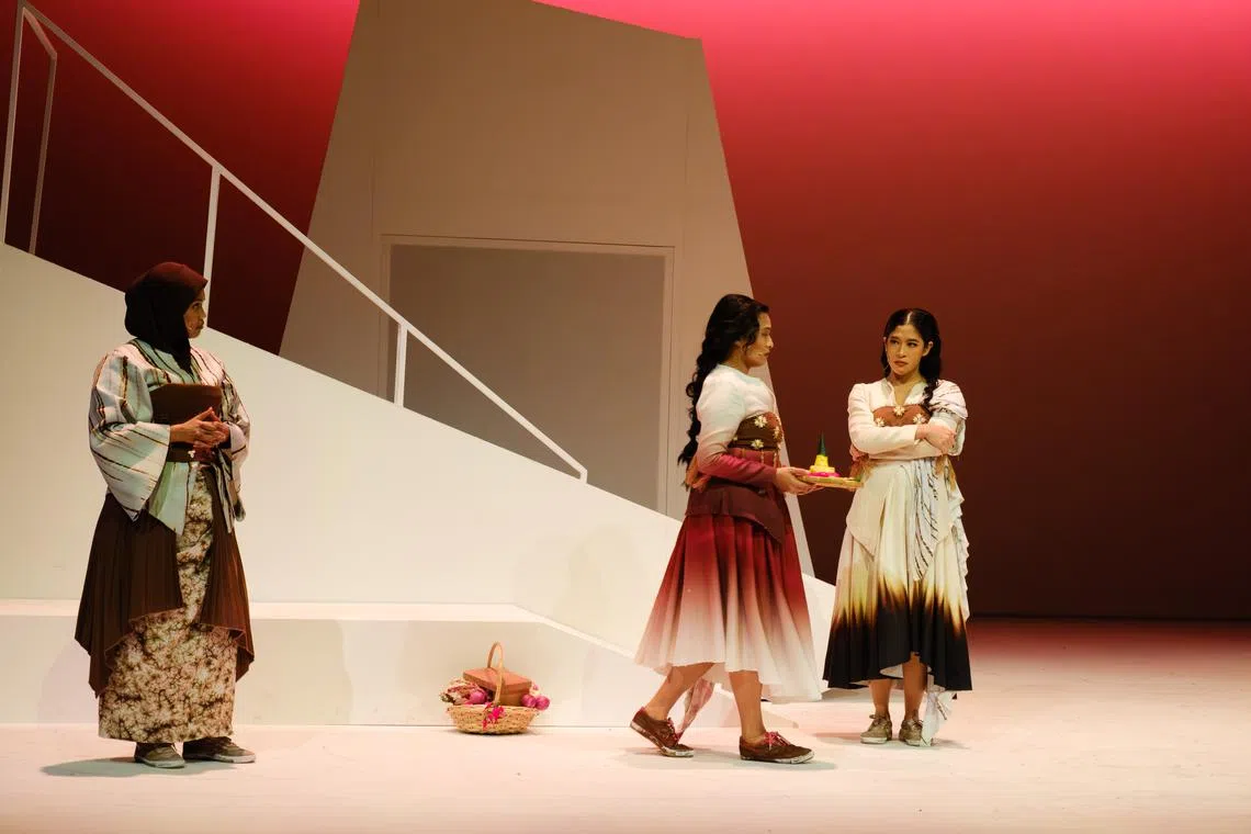 (From left) Siti Hajar Abdul Gani plays stepmother to Bawang Merah (Nabila Huda) and mother to  Bawang Putih (Munah Bagharib) in Teater Ekamatra's Bawang Putih Bawang Merah, commissioned for and presented by Esplanade – Theatres on the Bay as part of Pesta Raya 2024.