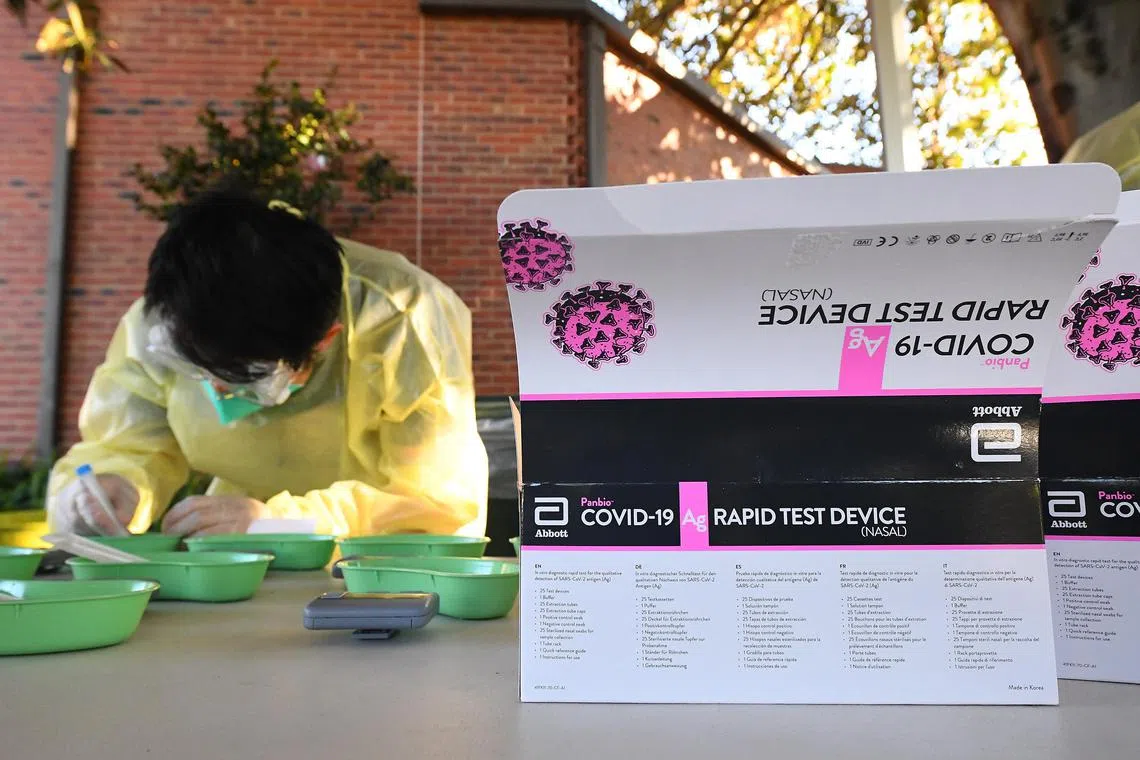 Healthcare workers preparing to administer Covid-19 Rapid 
antigen rapid tests to students on the Campus at Firbank Grammar School in Brighton, Melbourne, Australia, on Oct 14, 2021. 