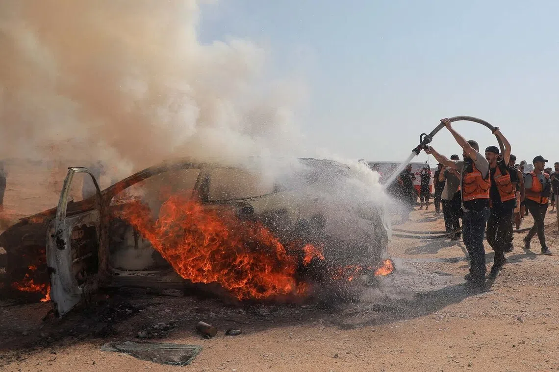 Civil defence firefighters attempt to extinguish a fire following an Israeli air strike that hit a vehicle and killed a senior police official, in Gaza City, August 13, 2026. REUTERS/Stringer TPX IMAGES OF THE DAY