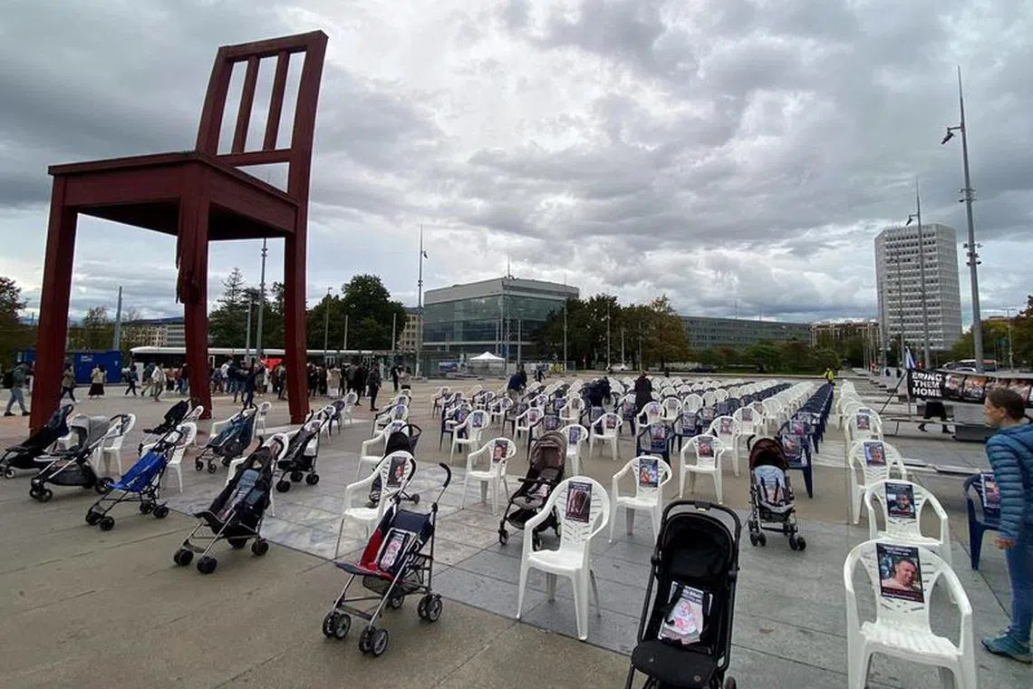 A group of Geneva citizens set up 222 empty chairs and strollers for children that symbolically represent hostages and missing people waiting to come home, following a deadly infiltration of Israel by Hamas gunmen from the Gaza Strip, on Place des Nations in front of the United Nations in Geneva, Switzerland, October 26, 2023. REUTERS/Cecile Mantovani/File Photo