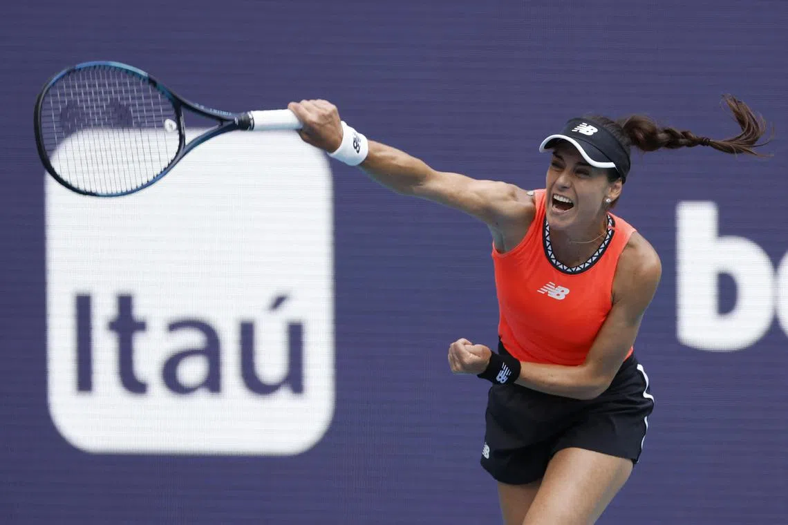 Sorana Cirstea serving against Aryna Sabalenka in the Miami Open women's singles quarterfinal at Hard Rock Stadium. 