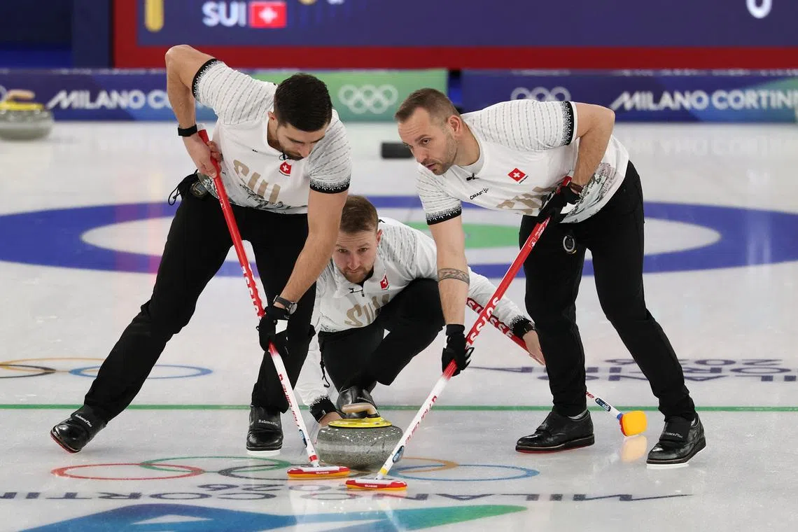 Milano Cortina 2026 Olympics - Curling - Men's Round Robin Session 11 - Norway vs Switzerland - Cortina Curling Olympic Stadium, Cortina d'Ampezzo, Italy - February 18, 2026. Yannick Schwaller of Switzerland, Sven Michel of Switzerland and Pablo Lachat-Couchepin of Switzerland in action during the match against Norway REUTERS/Issei Kato