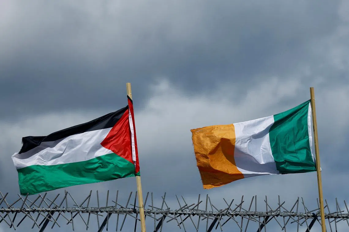 FILE PHOTO: Flags of Palestine and Ireland flutter next to each other over the International Wall in support of Gaza in Belfast, Northern Ireland, on March 29, 2024. 