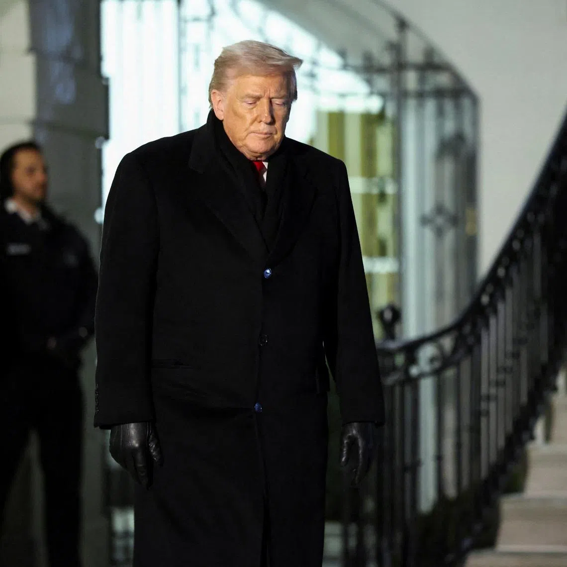 U.S. President Donald Trump walks as he departs for Davos, Switzerland from the South Lawn of the White House in Washington, D.C., U.S., January 20, 2026. REUTERS/Kevin Lamarque