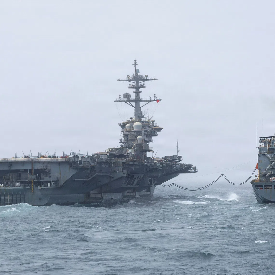 The U.S. Navy Nimitz-class aircraft carrier USS Abraham Lincoln, which is supporting U.S. military operations in the war with Iran, conducts a replenishment-at-sea with fleet replenishment oiler USNS Henry J. Kaiser, August 16, 2026.   U.S. Navy/Handout via REUTERS. THIS IMAGE HAS BEEN SUPPLIED BY A THIRD PARTY