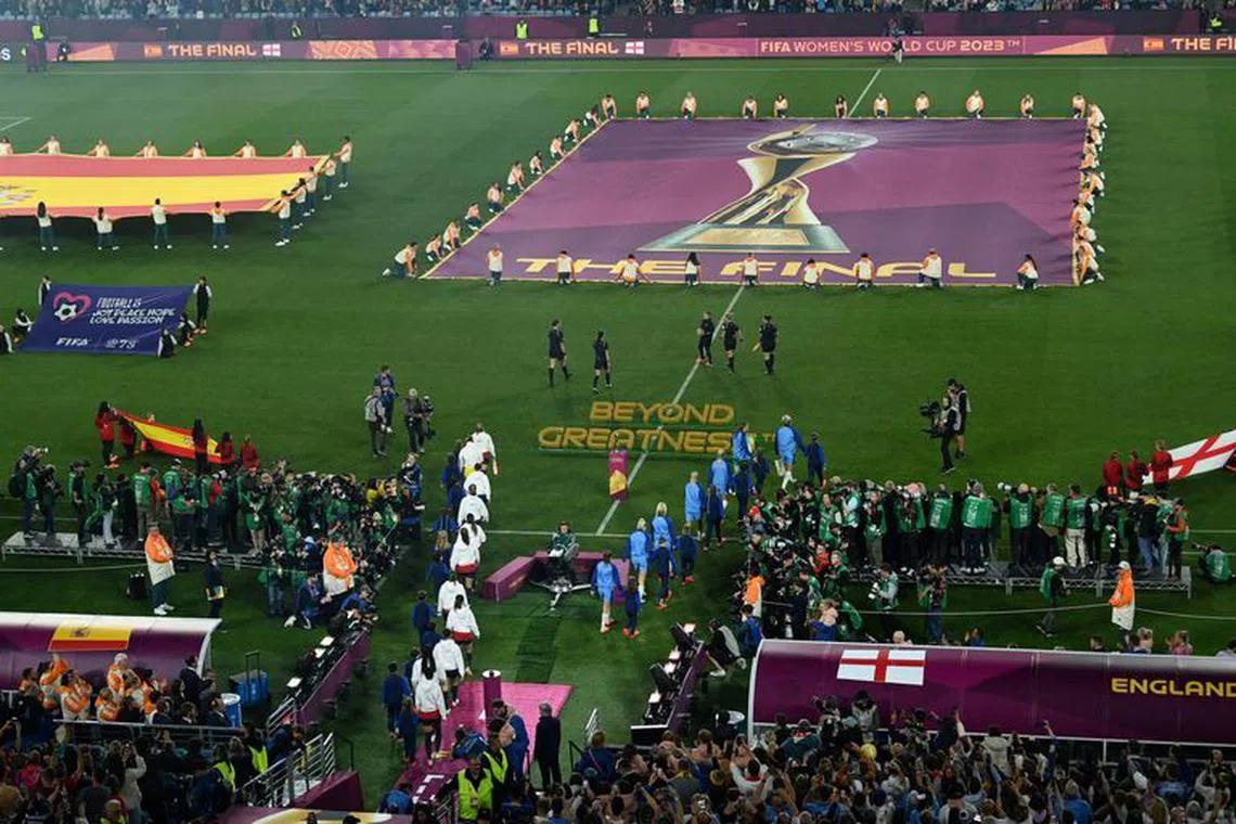 FILE PHOTO: Soccer Football - FIFA Women's World Cup Australia and New Zealand 2023 - Final - Spain v England - Stadium Australia, Sydney, Australia - August 20, 2023 General view as the Spain and England players walk out ahead of the match REUTERS/Jaimi Joy/File Photo
