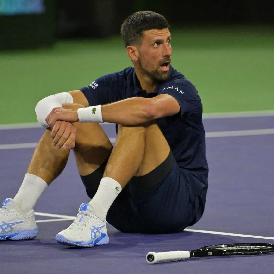 FILE PHOTO: Mar 11, 2026; Indian Wells, CA, USA;  Novak Djokovic (SRB) takes a moment on the court after a long rally during his fourth round match against Jack Draper (GBR) in the BNP Paribas Open at the Indian Wells Tennis Garden. Mandatory Credit: Jayne Kamin-Oncea-Imagn Images/File Photo