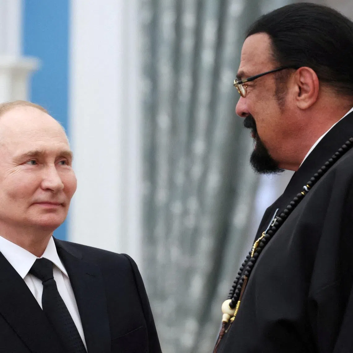 FILE PHOTO: Russian President Vladimir Putin and Russian Foreign Ministry's special representative for Russian-American humanitarian relations, actor and producer Steven Seagal, awarded with the Order of Friendship, attend a ceremony to present highest state decorations at the Kremlin's St. Catherine Hall in Moscow, Russia May 30, 2024. Sputnik/Alexander Kazakov/Pool via REUTERS/ File Photo