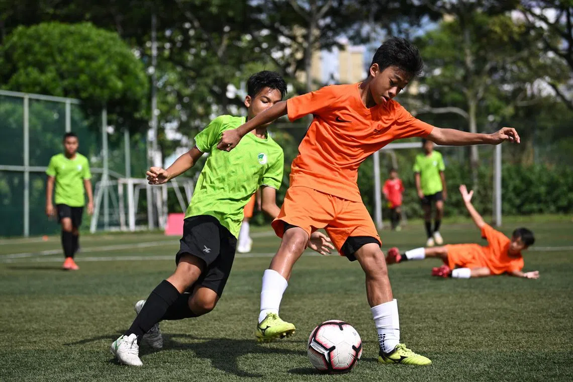 Singapore Sports School (in orange) against Jurongville Secondary School in the finals of the SFA Challenge Cup at Jurongville Secondary School on July 23, 2022. Singapore Sports School won 1-0. It was part of the launch of Unleash the Roar’s Singapore Football Academy.