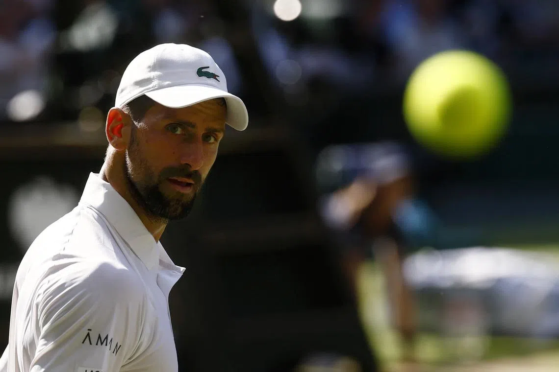 FILE PHOTO: Tennis - Wimbledon - All England Lawn Tennis and Croquet Club, London, Britain - July 11, 2025 Serbia's Novak Djokovic looks on during his semi final match against Italy's Jannik Sinner REUTERS/Stephanie Lecocq/ File Photo