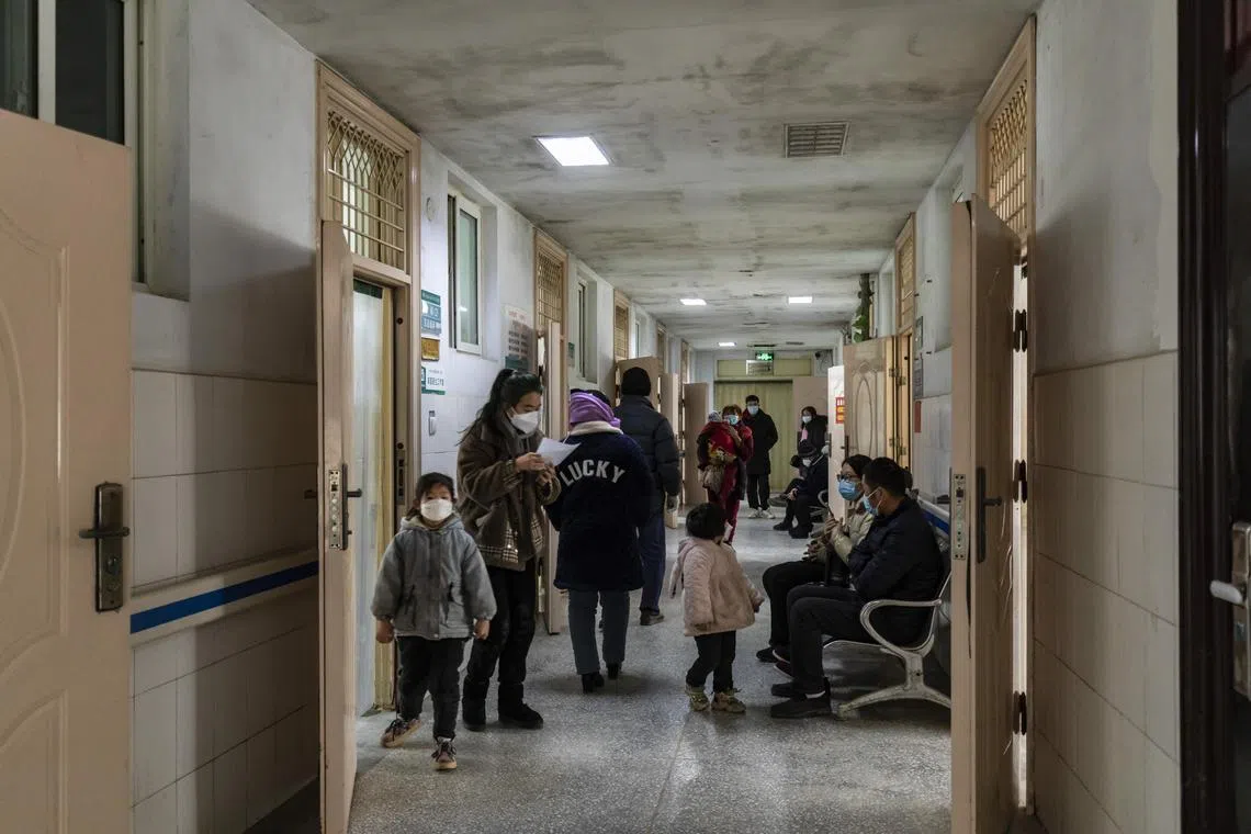 Patients waiting in the hallway of a community health center in Niutun town in  Henan Province.  