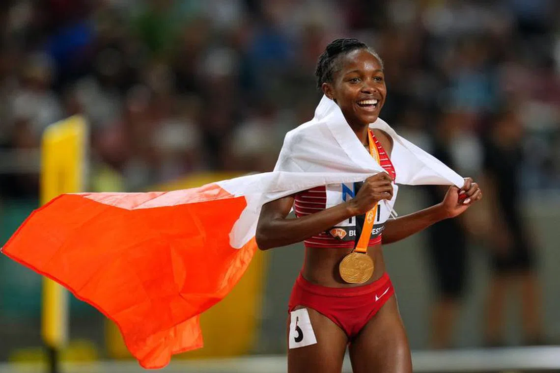 Athletics - World Athletics Championship - Women's 3000m Steeplechase Final - Budapest, Hungary - August 27, 2023 Gold medallist Bahrain's Winfred Mutile Yavi celebrates after winning the final REUTERS/Aleksandra Szmigiel