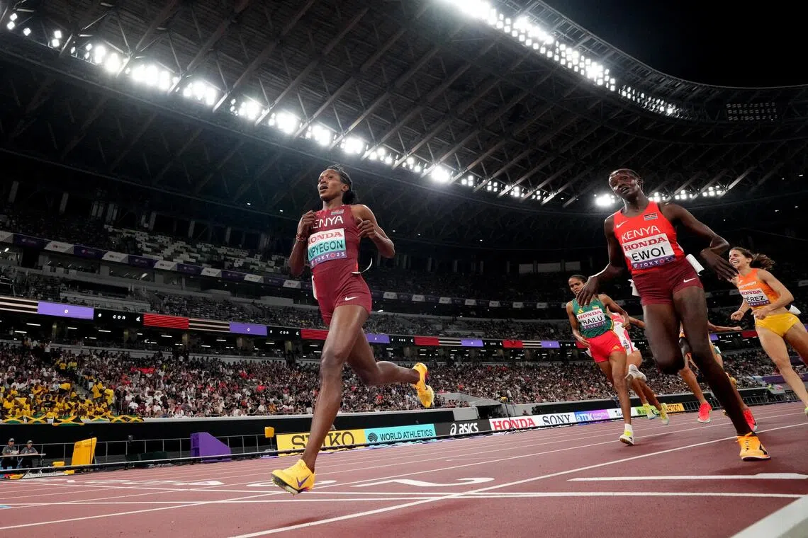Kenya's Faith Kipyegon crosses the line to win heat 1 of the 1,500m at the World Athletics Championships.