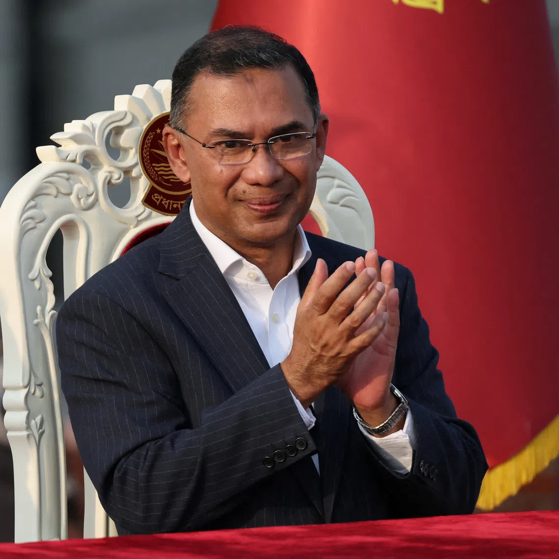Bangladesh’s newly sworn in Prime Minister Tarique Rahman claps during an oath taking ceremony at the South Plaza of the parliament building, following BNP's landslide victory in the national polls, in Dhaka, Bangladesh, February 17, 2026. REUTERS/Mohammad Ponir Hossain