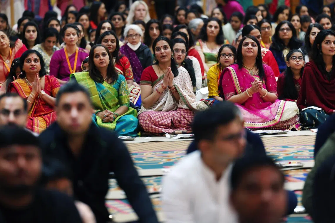 People attending a prayer service during Diwali celebrations at Neasden Temple in London, Britain on Nov 12, 2023. 