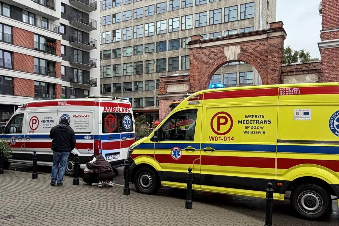 Ambulances waiting outside a further education college in Warsaw, Poland, on Oct 10, following a knife attack. The attacker was said to be a 21-year-old student of the college.