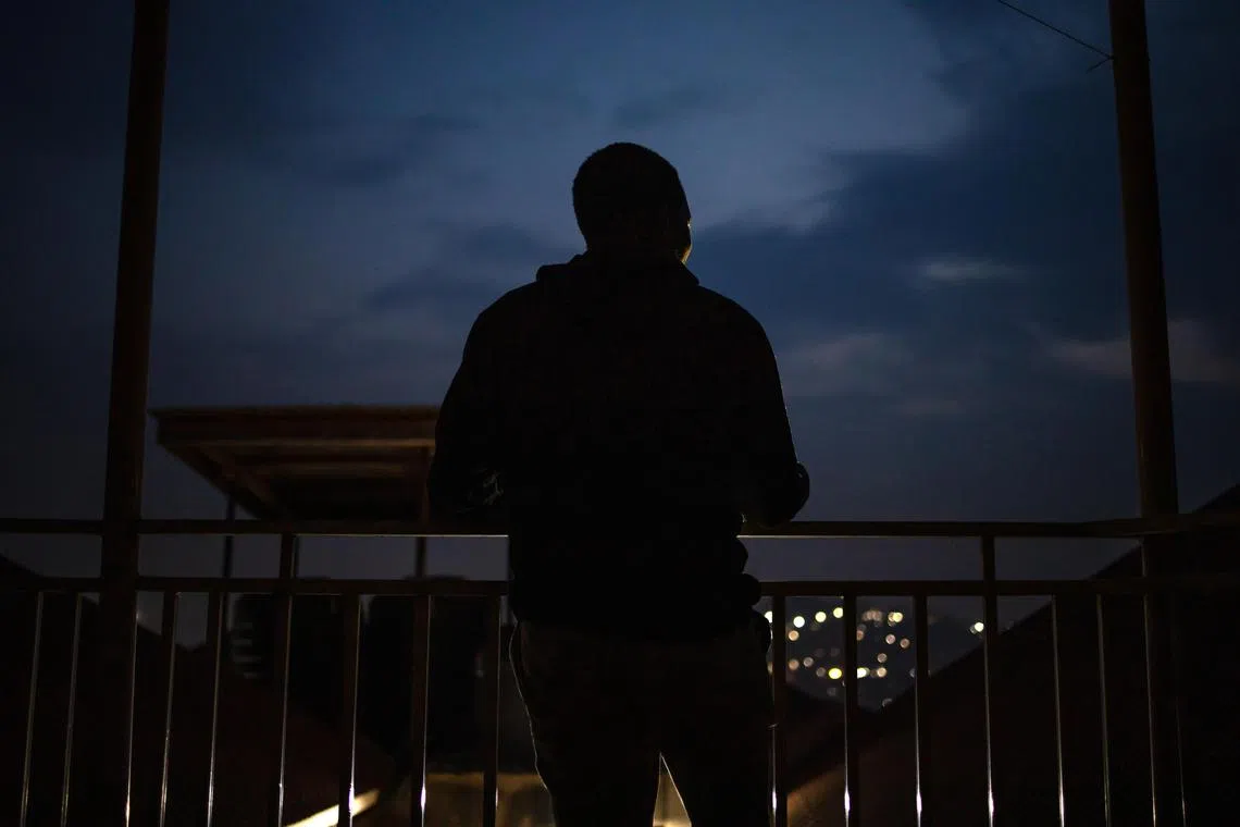 Jalil Muyeke at his home in Uganda in July 2024. His captors in Myanmar ran what are called Òpig butcheringÓ schemes, in which fraudsters build trust through a fake romance or friendship.  (Stuart Tibaweswa/The New York Times)