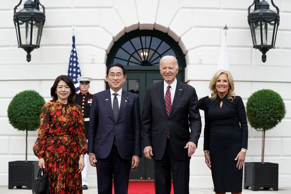 U.S. President Joe Biden and first lady Jill Biden pose for a picture as they welcome Japanese Prime Minister Fumio Kishida and his wife Yuko Kishida to the White House, at the start of their state visit to Washington, U.S., April 9, 2024.  REUTERS/Kevin Lamarque
