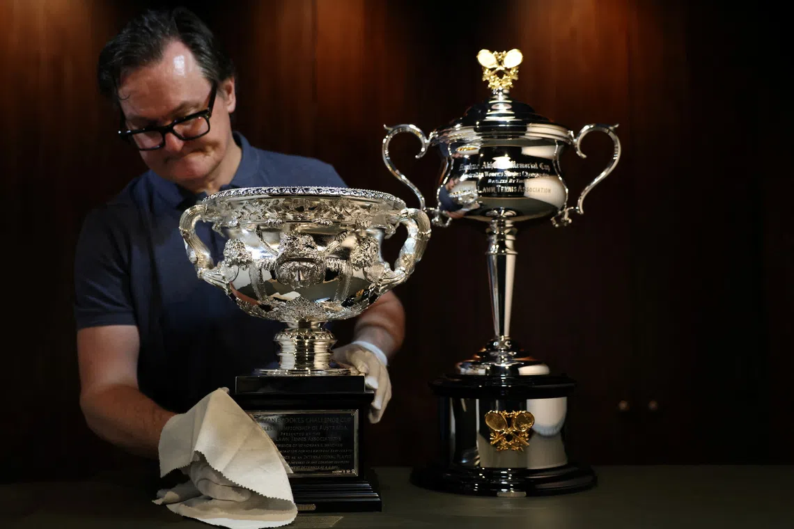 Darren May, General Manager at W.J. Sanders, poses with the Australian Open 2026 Norman Brookes Challenge Cup and Daphne Akhurst Memorial Cup, in Sydney, Australia, December 12, 2025. REUTERS/Hollie Adams