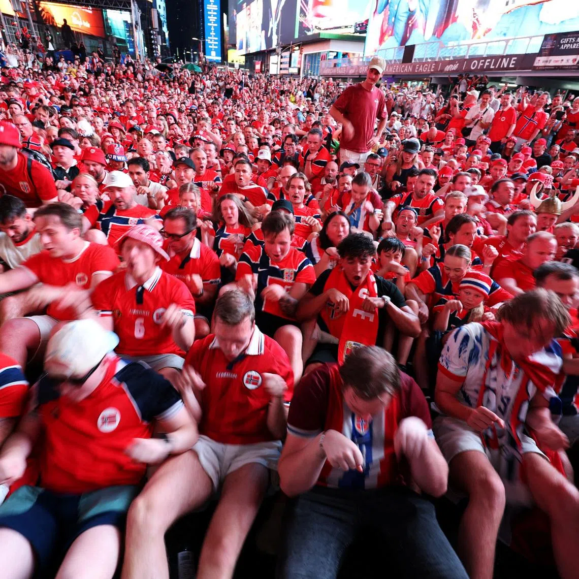 Soccer Football - FIFA World Cup 2026 - Norway fans perform their trademark Viking Row in Times Square - New York City, New York, U.S. - July 3, 2026 Norway fans perform the 'Viking Row' celebration at Times Square in New York City REUTERS/John Sibley