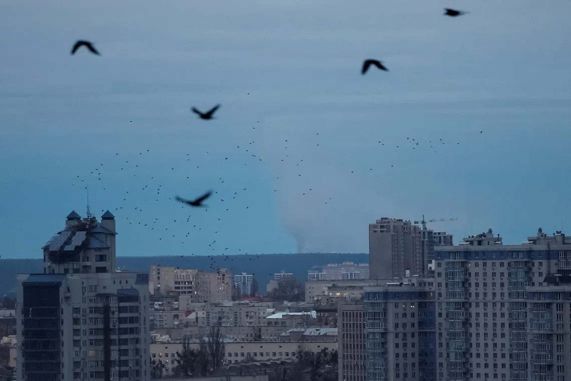 Smoke rises in the city after Russian drone and missile strikes in Kyiv on Dec 23. Amid the continued fierce fighting, territory remains the main diplomatic stumbling block.