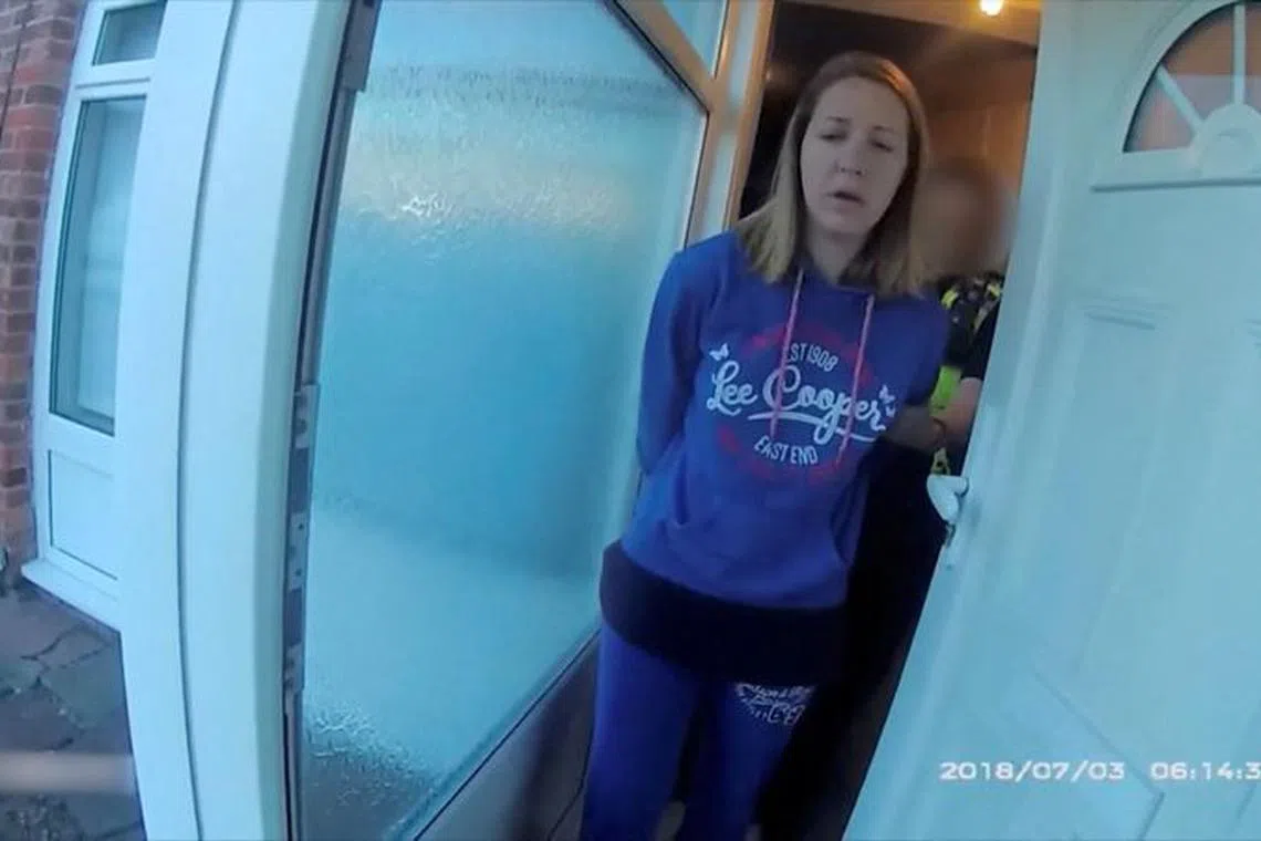 A view of Lucy Letby, who was on trial at Manchester Crown Court charged with the murder of seven babies, being taken in custody by police, in Chester, Britain, in this screengrab obtained from an undated Handout video obtained by Reuters on August 17, 2023. Cheshire Constabulary/Handout via REUTERS/File photo