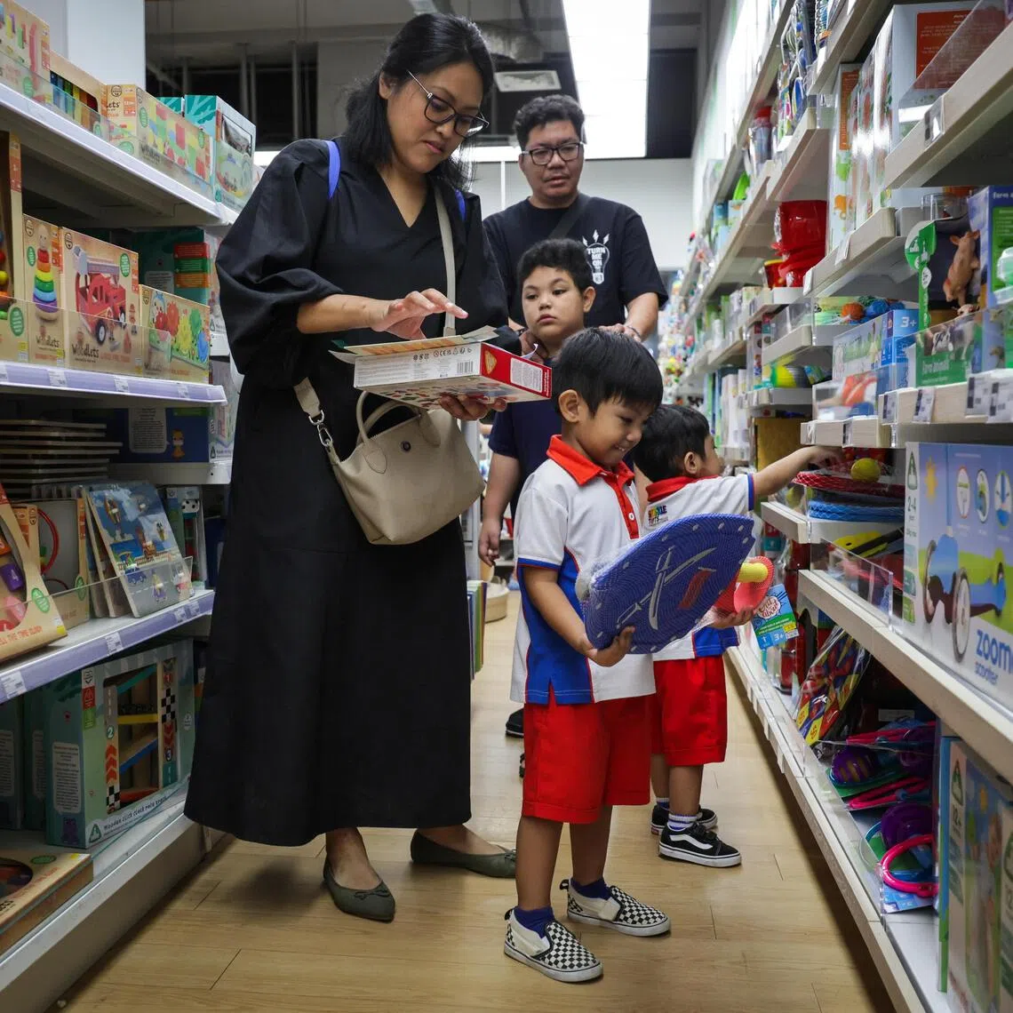 Beneficiaries browsing the merchandises during the launch of KidSTART Sparkle Homes at the Mothercare Experience Store @ HarbourFront Centre on 0ct 18, 2025.