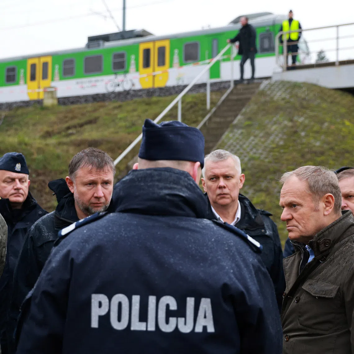 Polish Prime Minister Donald Tusk visits the site of a blast on railway of the Warsaw-Lublin line in Mika, Poland, November 17, 2025. KPRM/Handout via REUTERS