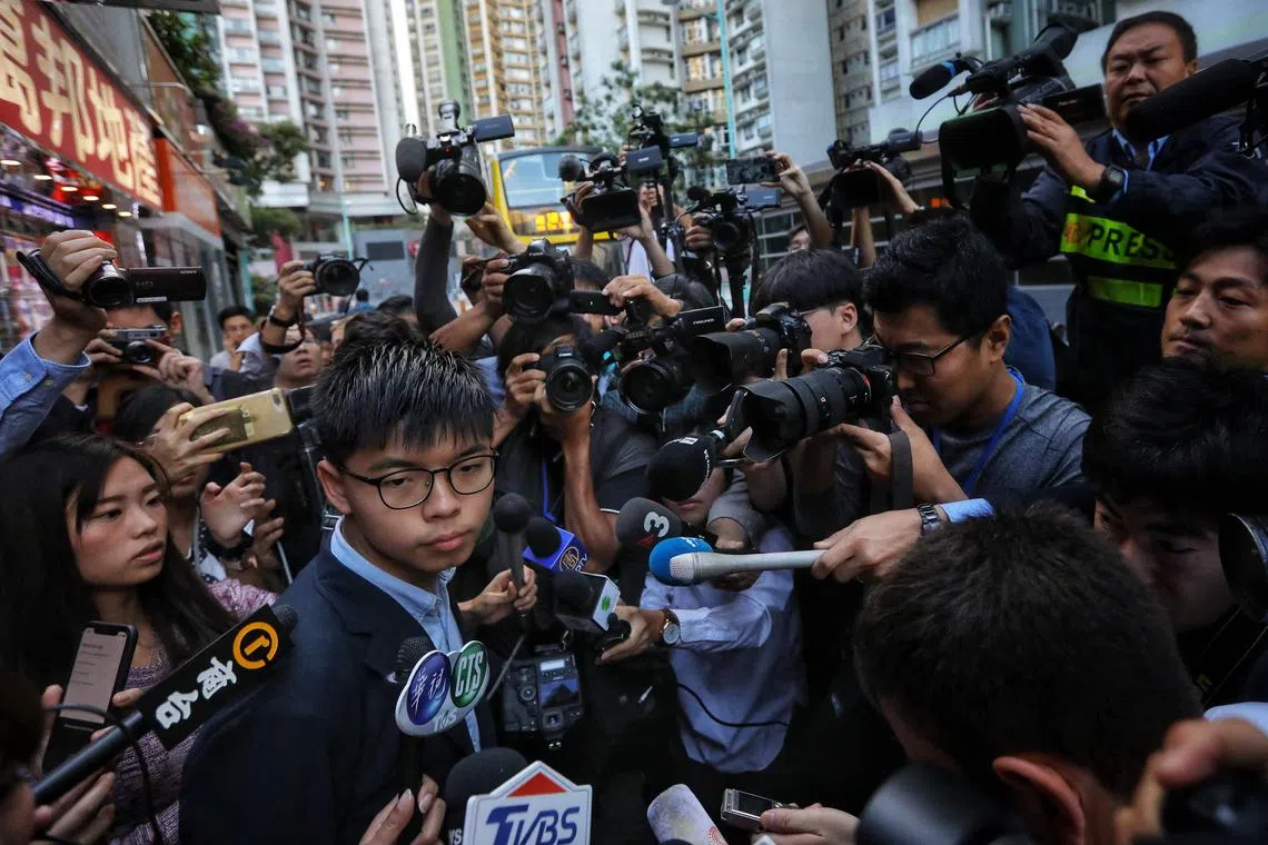 (FILES) File photo dated November 24, 2019 shows  Hong Kong's largest national security trial against 47 pro-democracy activists started its final arguments on November 29, 2023 more than 1,000 days since the case under the Beijing-imposed law began, the defendants represent a cross-section of Hong Kong's opposition -- including activists Joshua Wong and Lester Shum, professor Benny Tai and former lawmakers Claudia Mo and Au Nok-hin. (Photo by VIVEK PRAKASH / AFP) / TO GO WITH: Hong Kong-China-politics-democracy-court-trial
