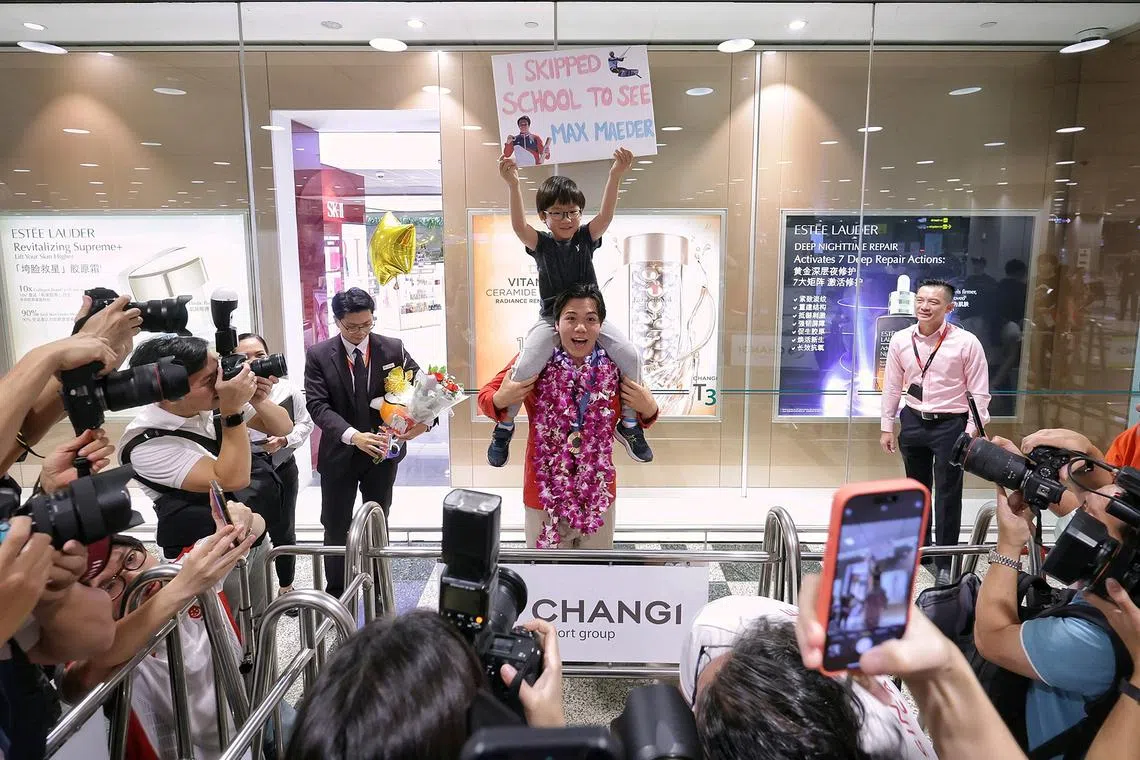 Caleb Tan, 6, was one of the young supporters who turned up to receive Singapore kitefoiler Maximilian Maeder with a self-made poster that read, “I skipped school to see Max Maeder”.