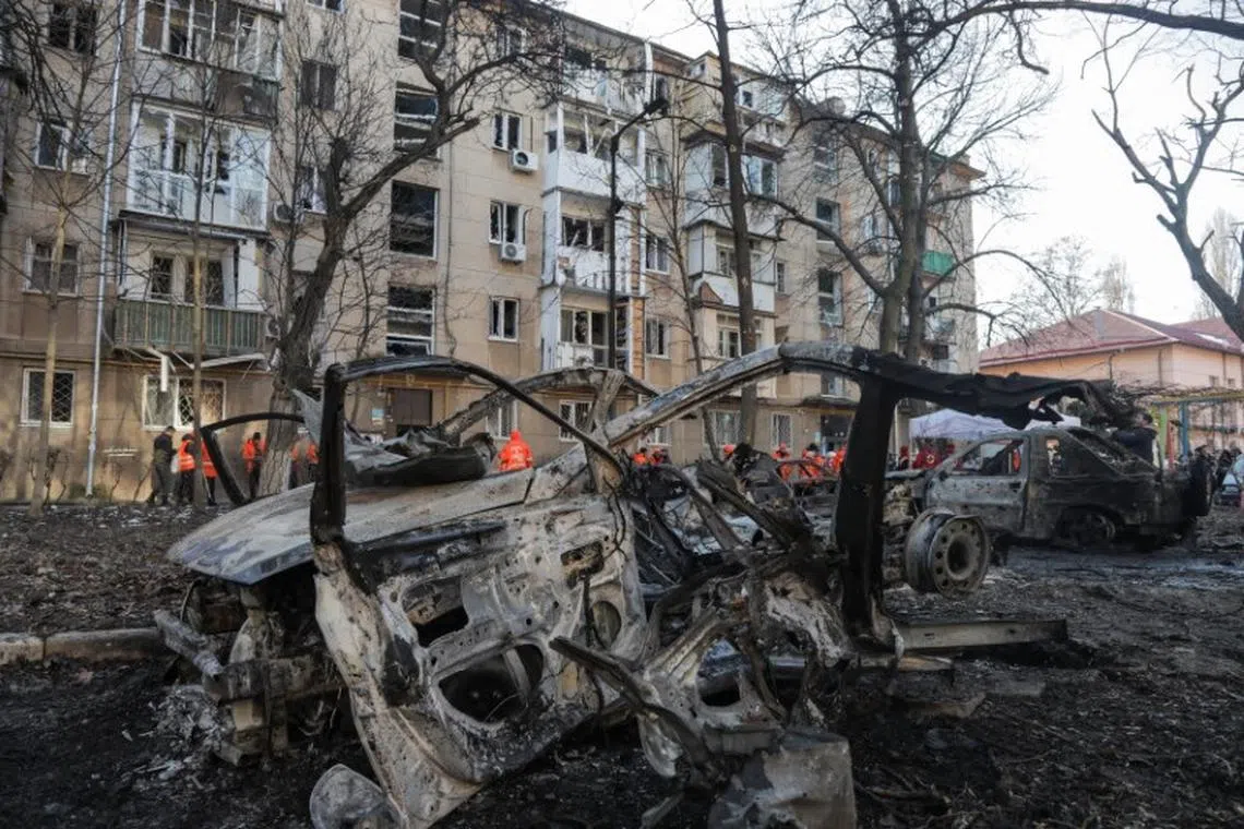 A view shows destroyed cars and an apartment building damaged during a Russian drone strike, amid Russia's attack on Ukraine, in Odesa, Ukraine January 17, 2024. REUTERS/Stringer