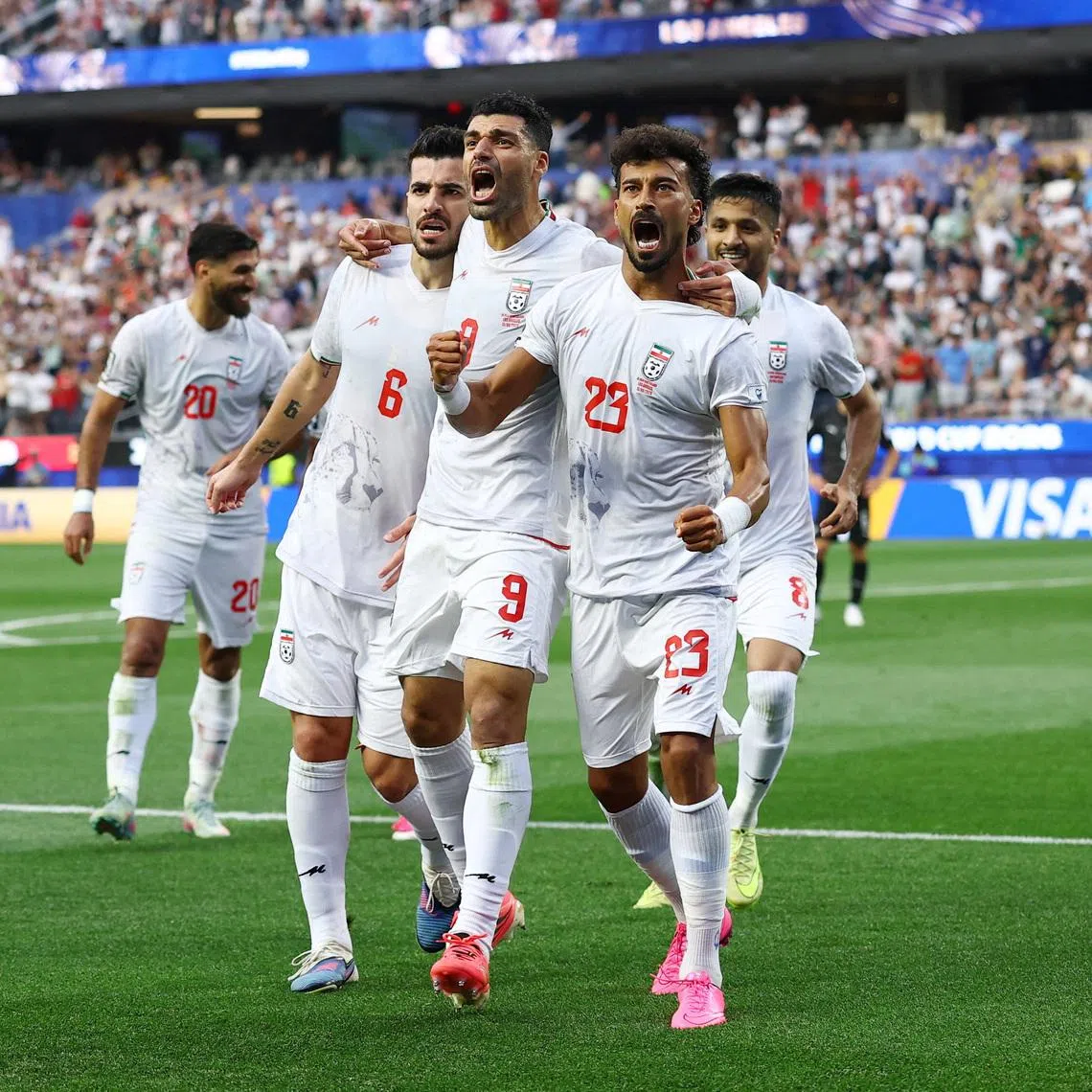 Soccer Football - FIFA World Cup 2026 - Group G - Iran v New Zealand - Los Angeles Stadium, Inglewood, California, U.S. - June 15, 2026 Iran's Ramin Rezaeian celebrates scoring their first goal with teammates REUTERS/Matthew Childs