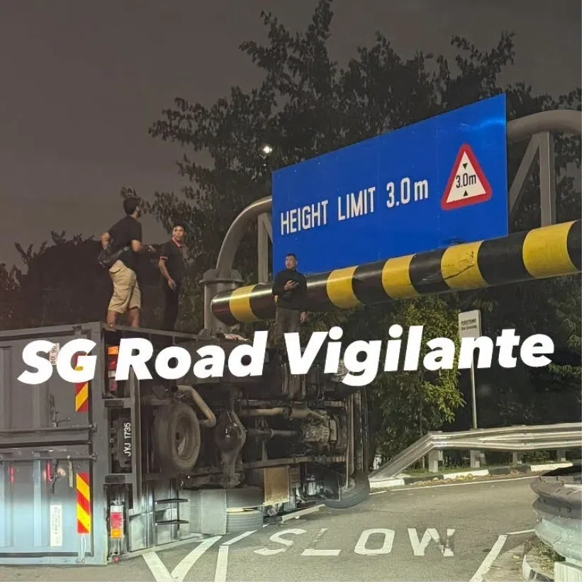 Photos uploaded on social media show the vehicle lying on its side, next to a height barrier indicating a 3m limit.