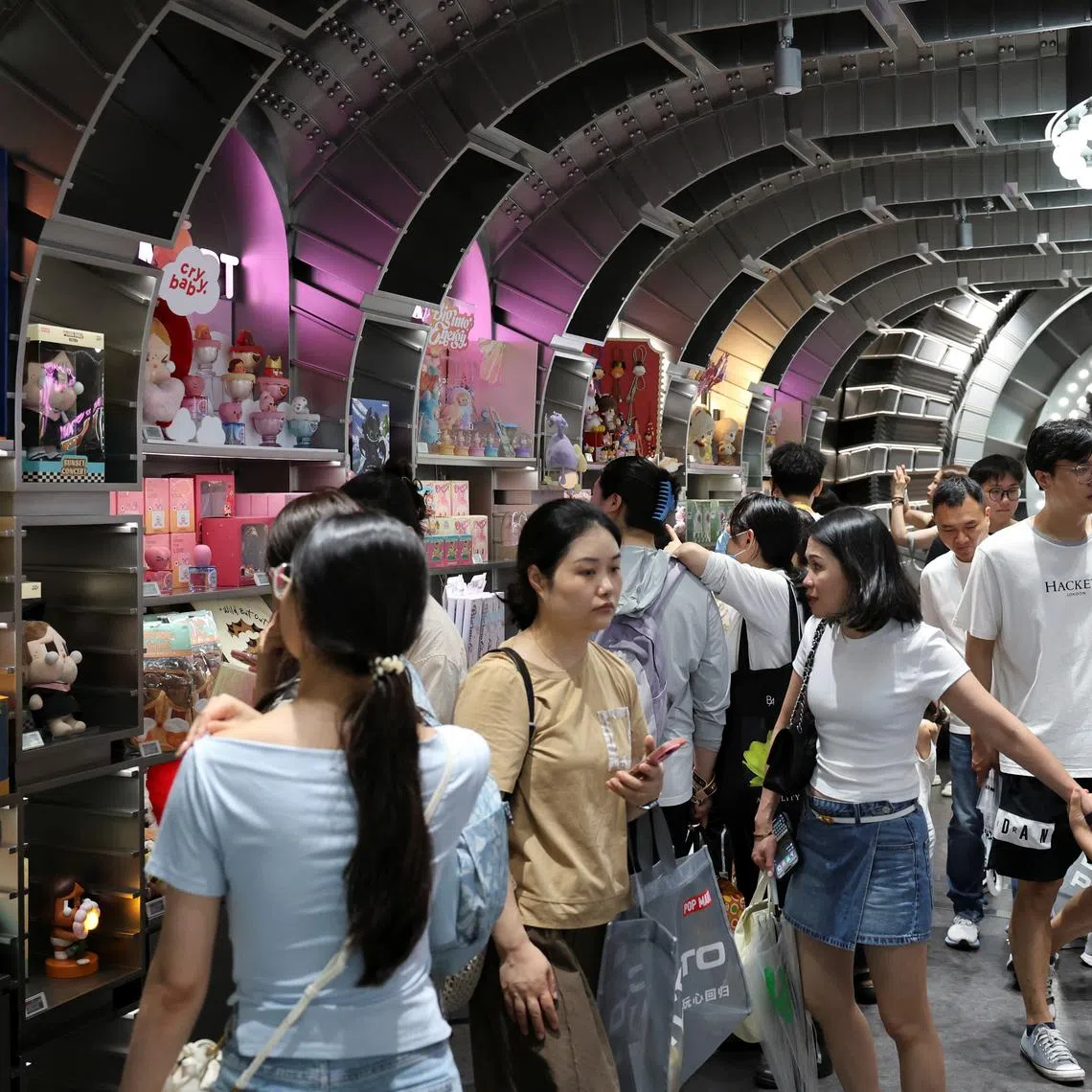 People visit the Pop Mart's flagship store in Shanghai, China June 13, 2025. REUTERS/Go Nakamura