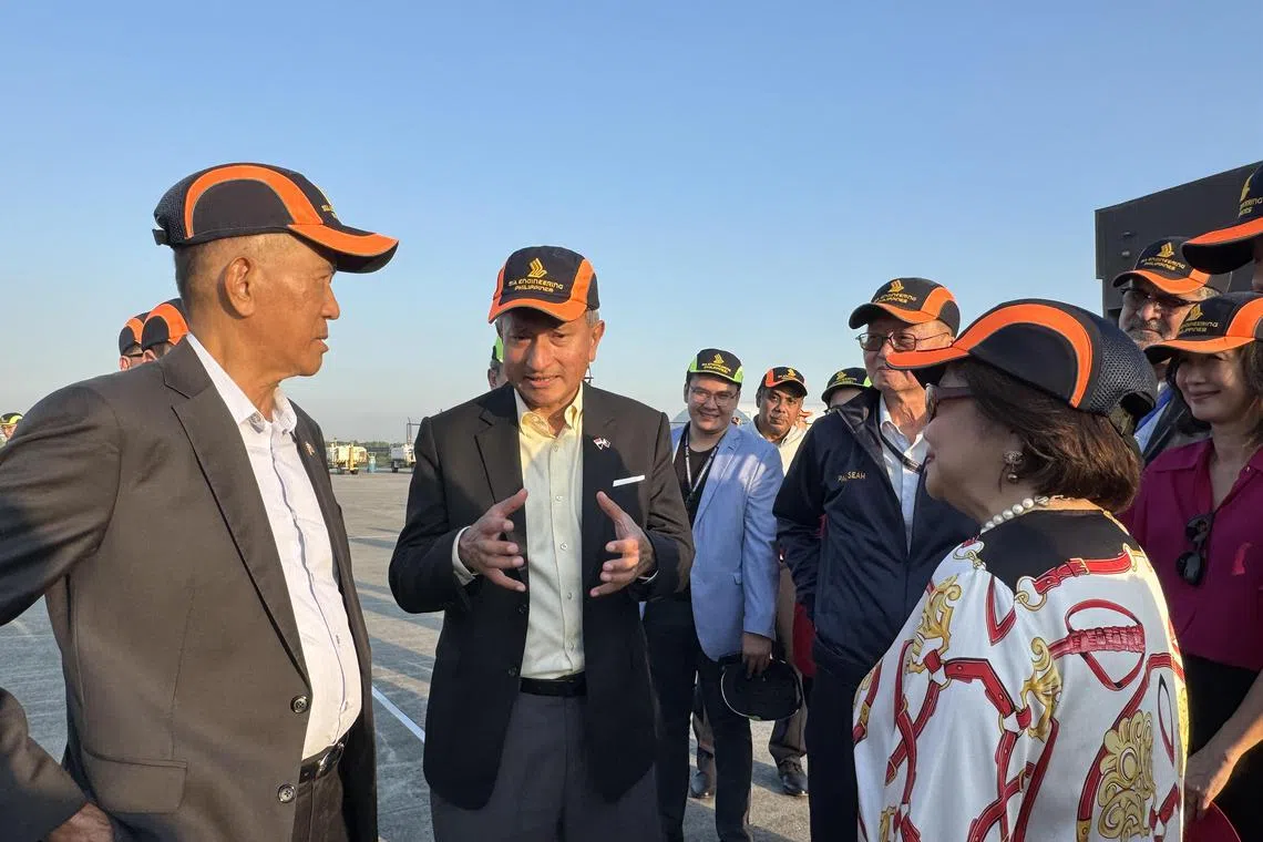 Foreign Minister Vivian Balakrishnan (5th from right) poses for a photo with Filipino officials running the Clark Freeport and Special Economic Zone, executives of Singaporean firm SIA Engineering in Pampanga, Philippines, and other officials on April 17, 2024.