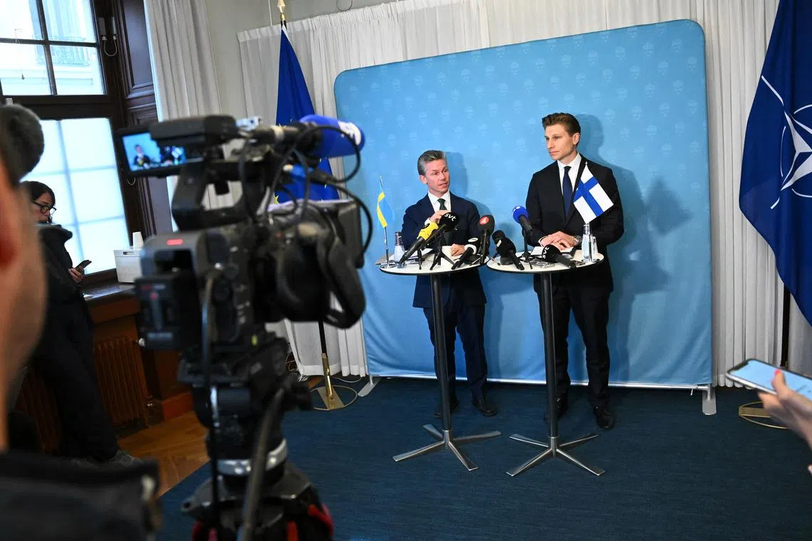 Sweden's Defence Minister Pal Jonson (left) and his Finnish counterpart Antti Hakkanen at a press conference in Stockholm on Sept 16.